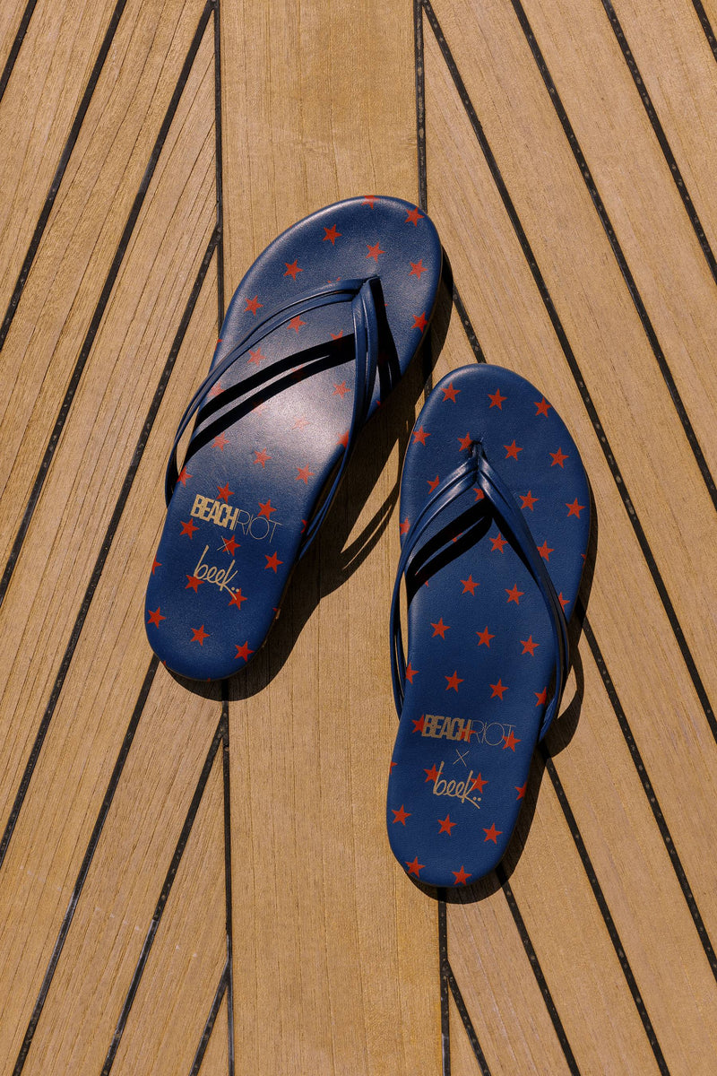 Navy flip flops with red stars