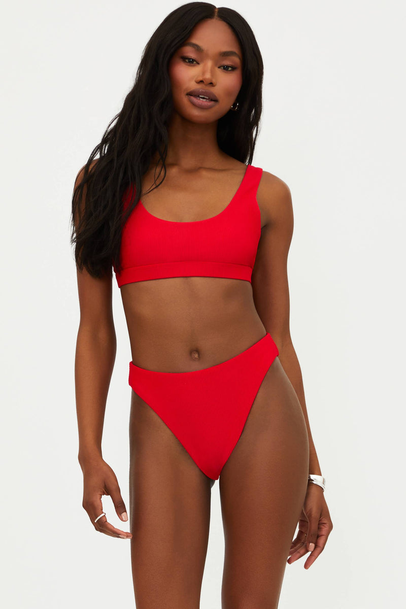 A red bikini top with a scoop neck and fixed straps, made from ribbed fabric.