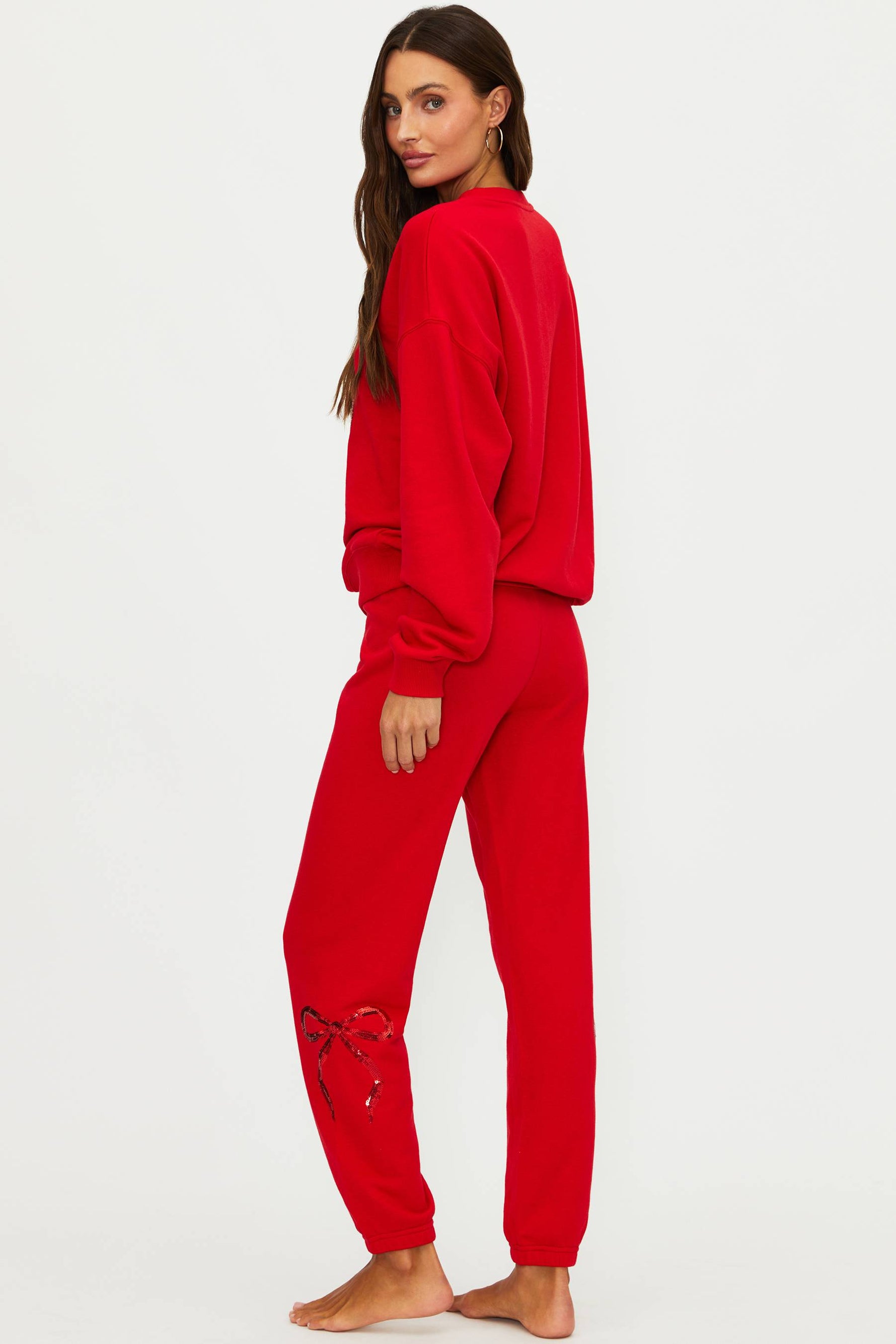 Red sweatshirt and jogger set on a white background