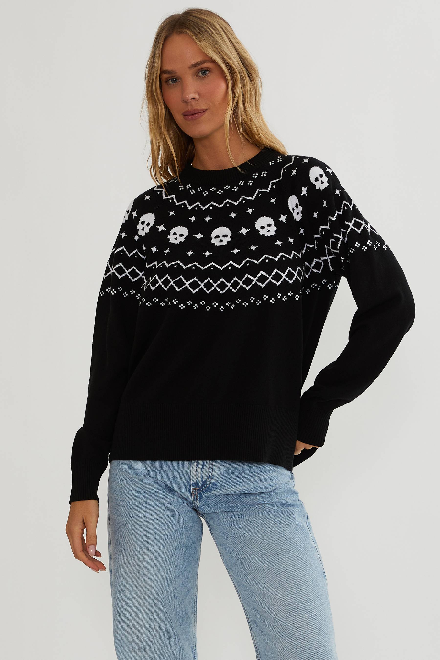 Black sweater with white detailing and white skulls.