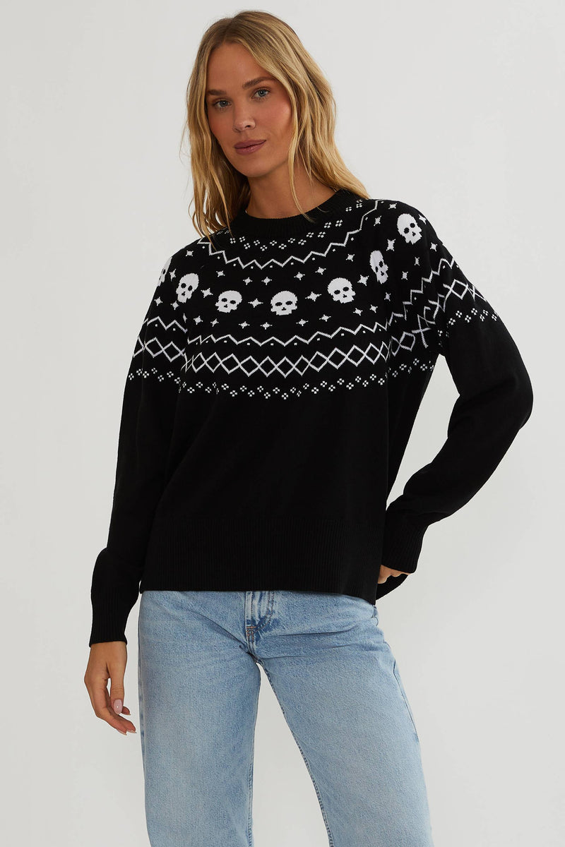 Black sweater with white detailing and white skulls.