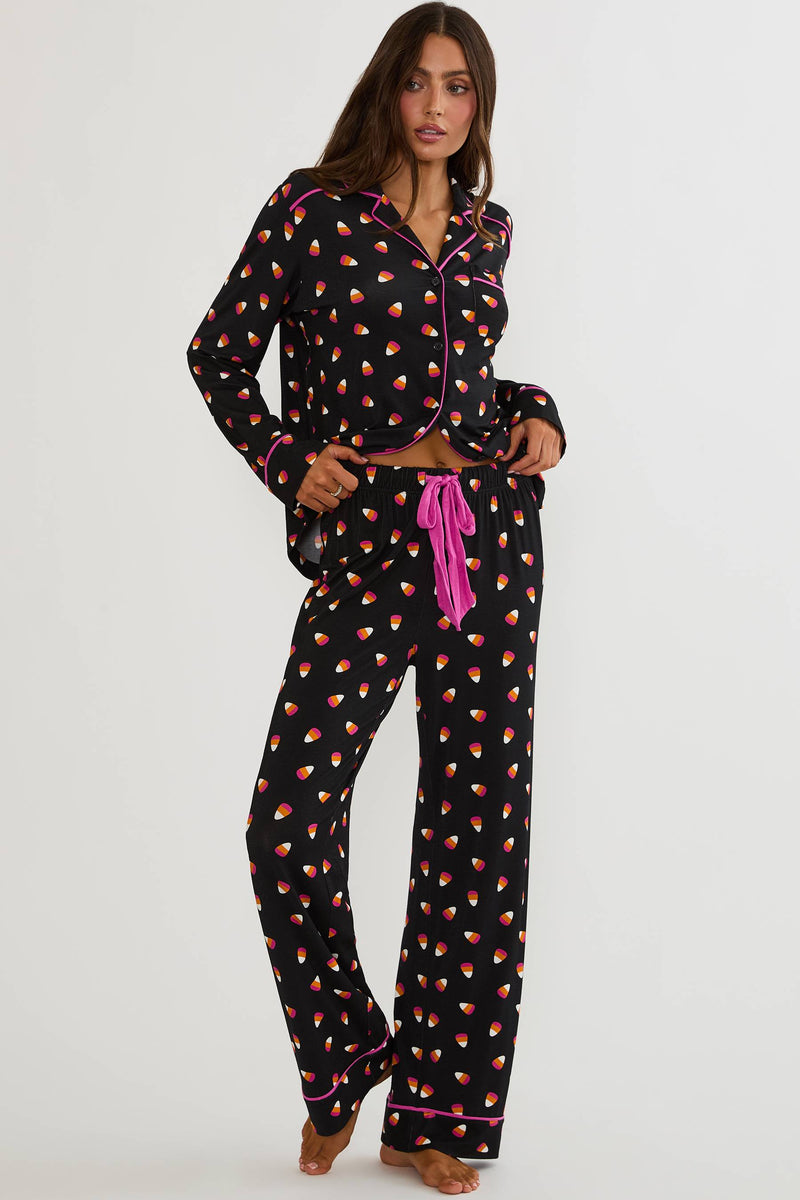 Long sleeve and pant pajama set with candy corns printed on. 