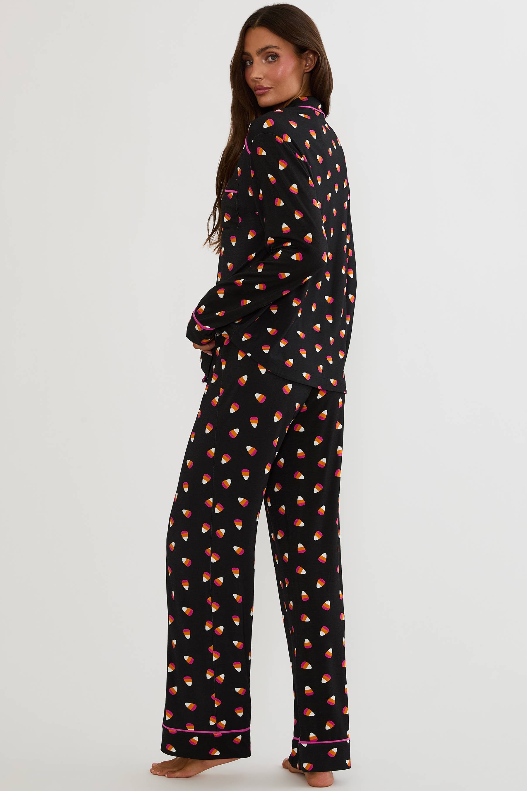 Long sleeve and pant pajama set with candy corns printed on. 