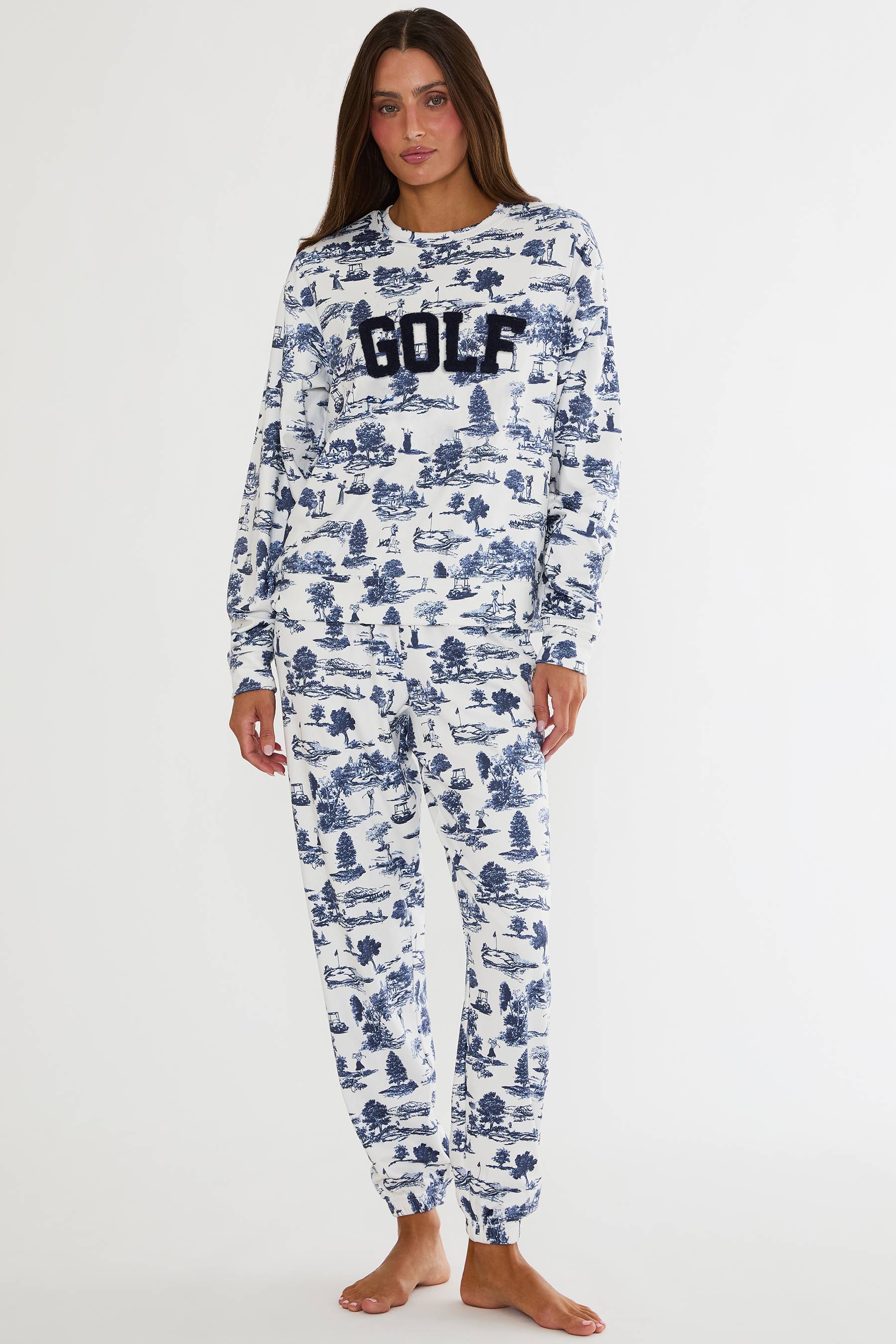Person wearing a blue and white patterned onesie with 'GOLF' text on a white background