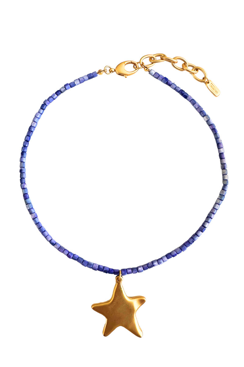 A beaded necklace featuring small blue beads and a polished gold star-shaped pendant, displayed on a clean white background.