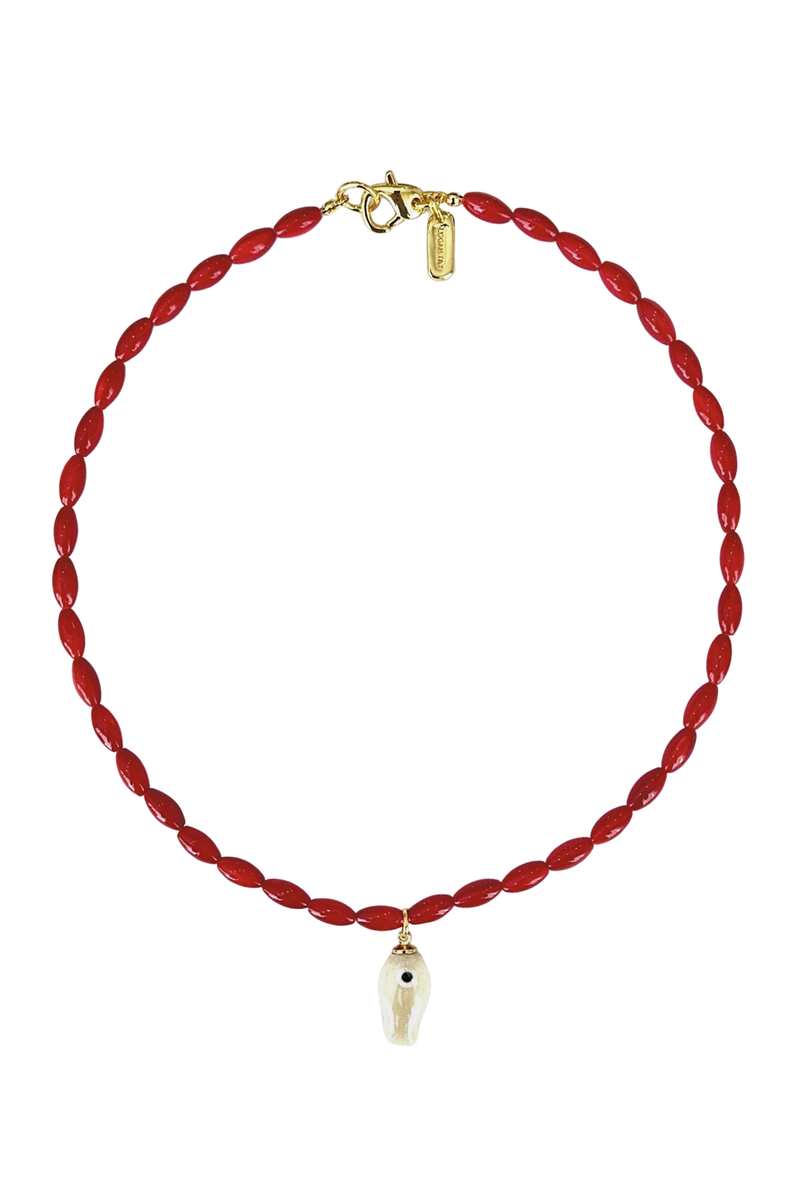 A red twisted cord necklace with a small white teardrop-shaped pendant featuring a black eye detail, complete with a gold clasp and tag, shown on a plain white background.