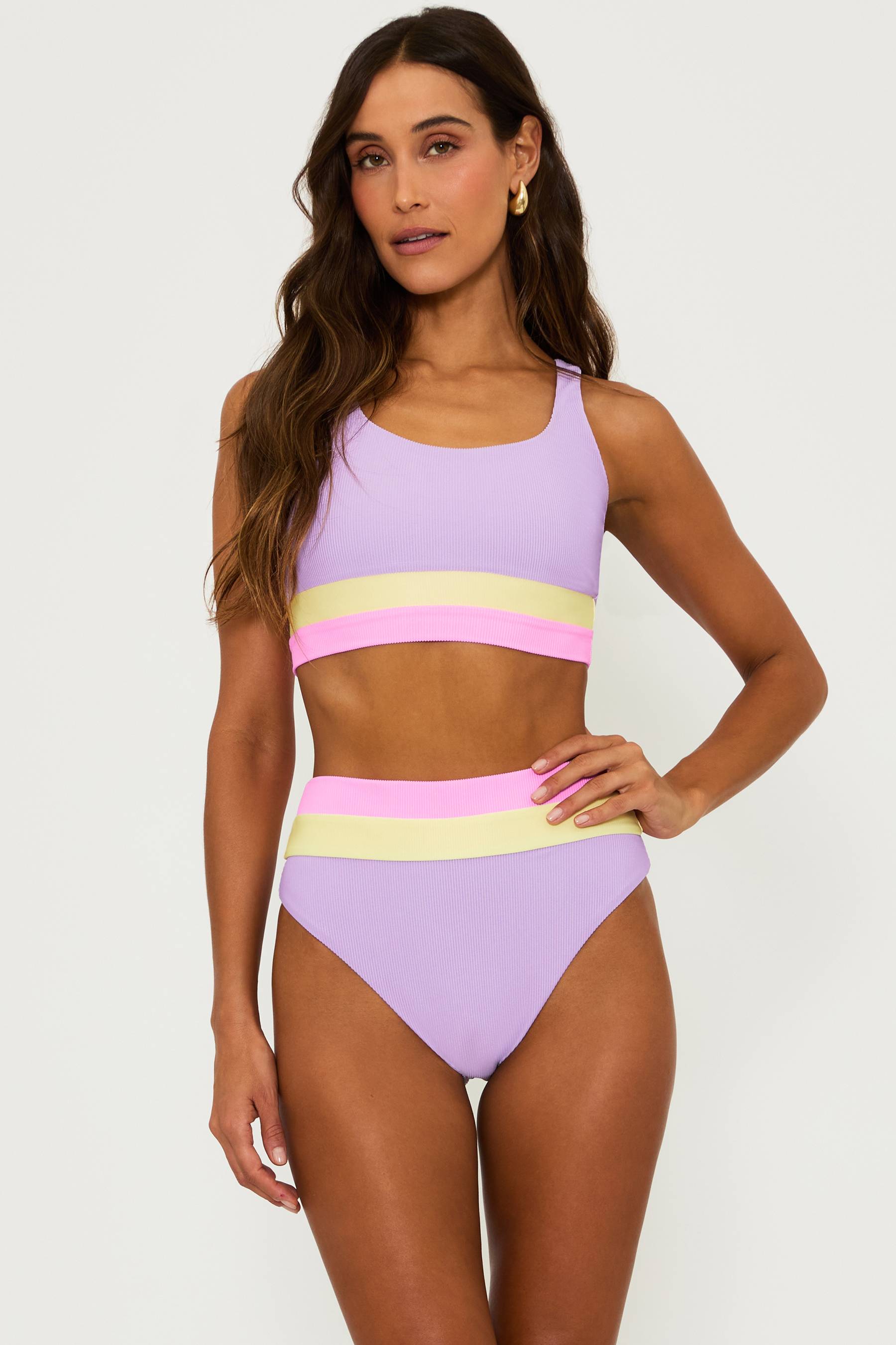 purple ribbed bikini set with pink and yellow stripped colorblock at the underband and waist