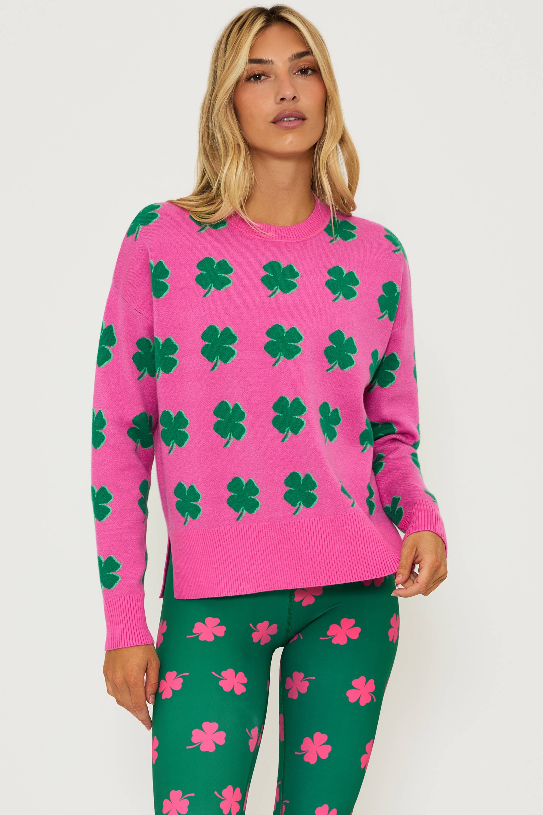 Pink sweater with green clover print