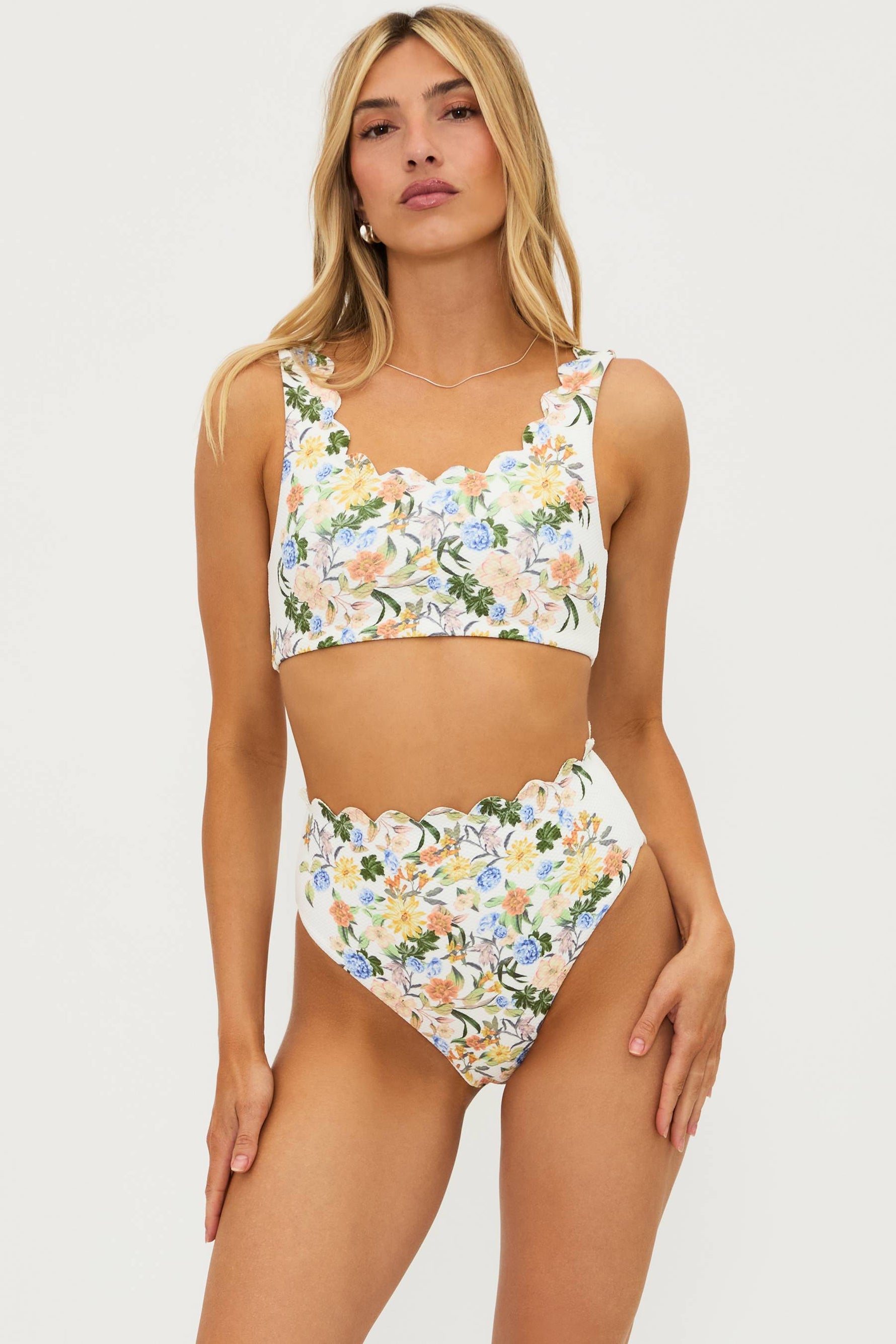 ivory two piece bikini set with floral details and waffle fabric