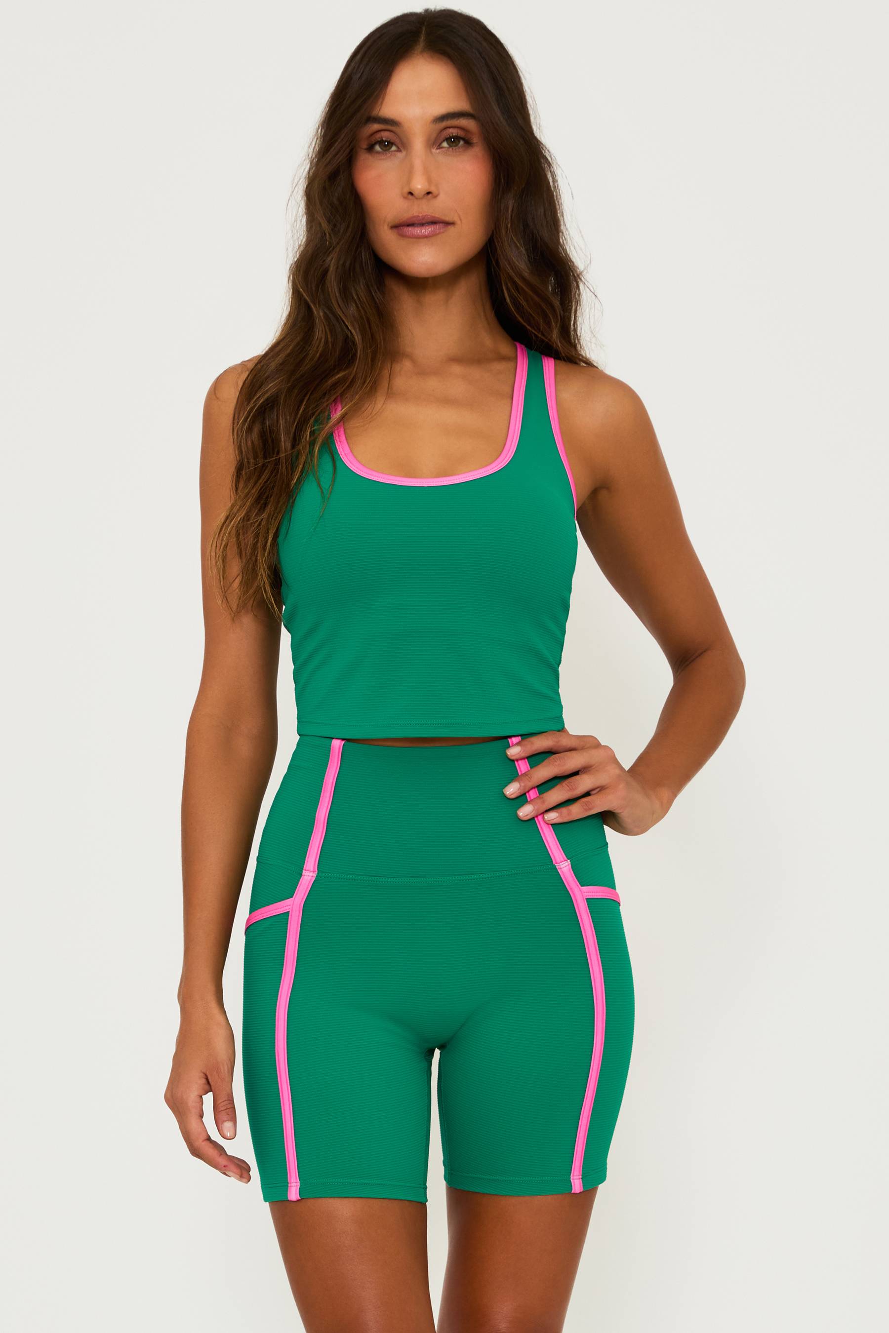 green ribbed active tank with pink piping and matching green shorts with pink piping