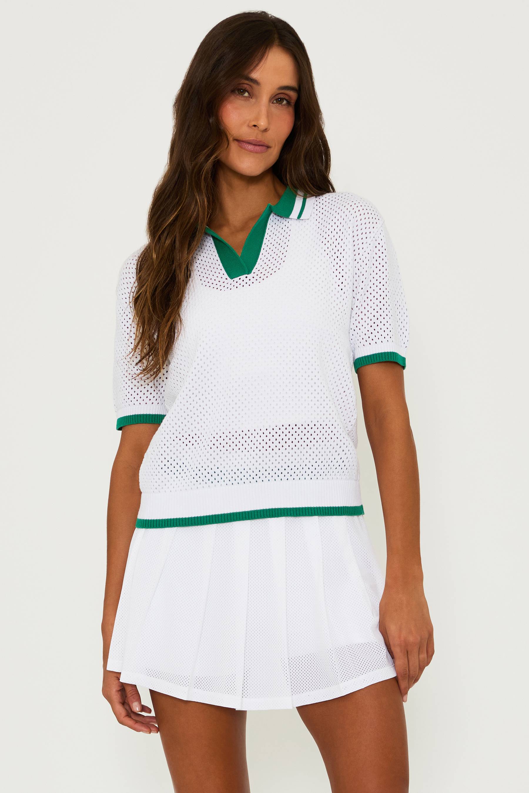 white mesh top with green contrast trim on the colar, cuffs and hem