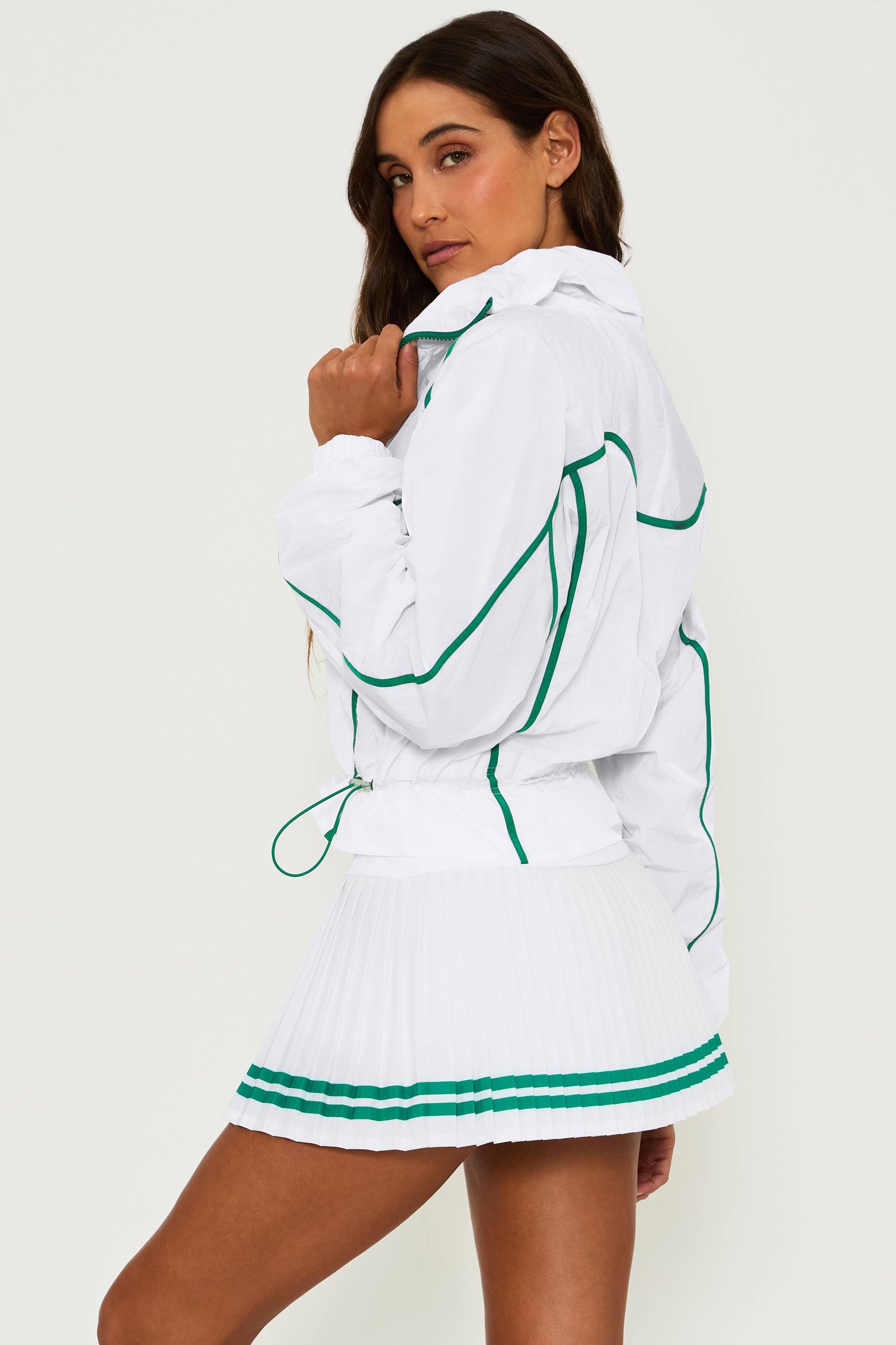 white running jacket with green piping detail