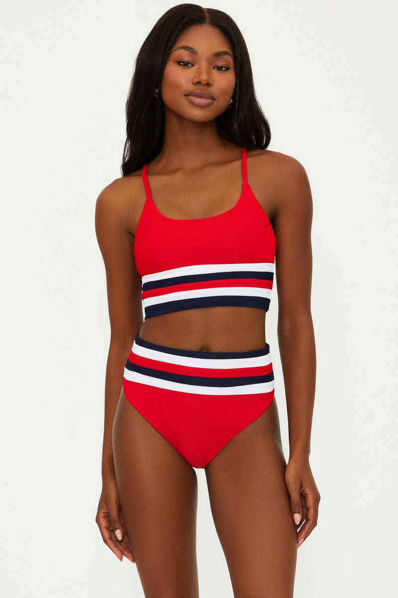 A red, white, and blue color-blocked swim top with adjustable straps and removable bra pads.