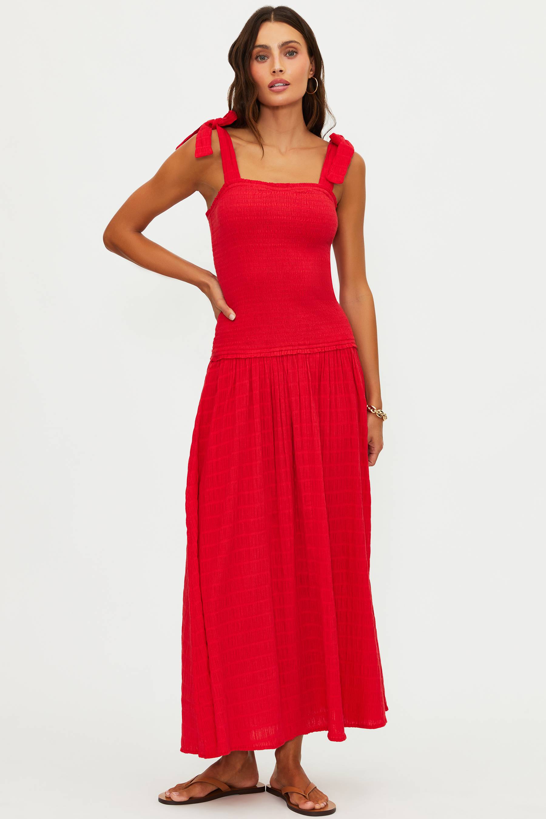 Woman wearing a red dress on a white background