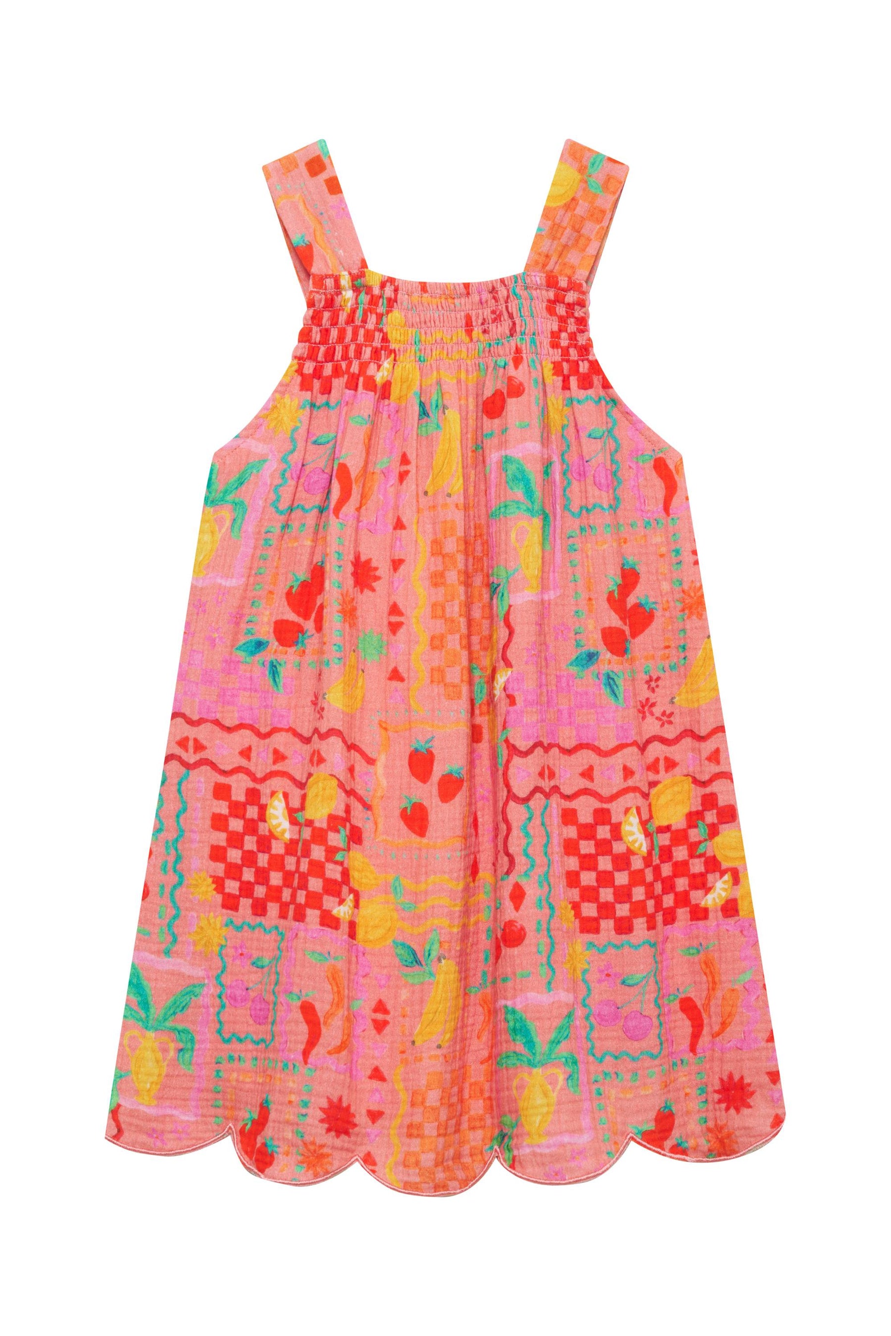 Colorful patterned dress with straps on a white background