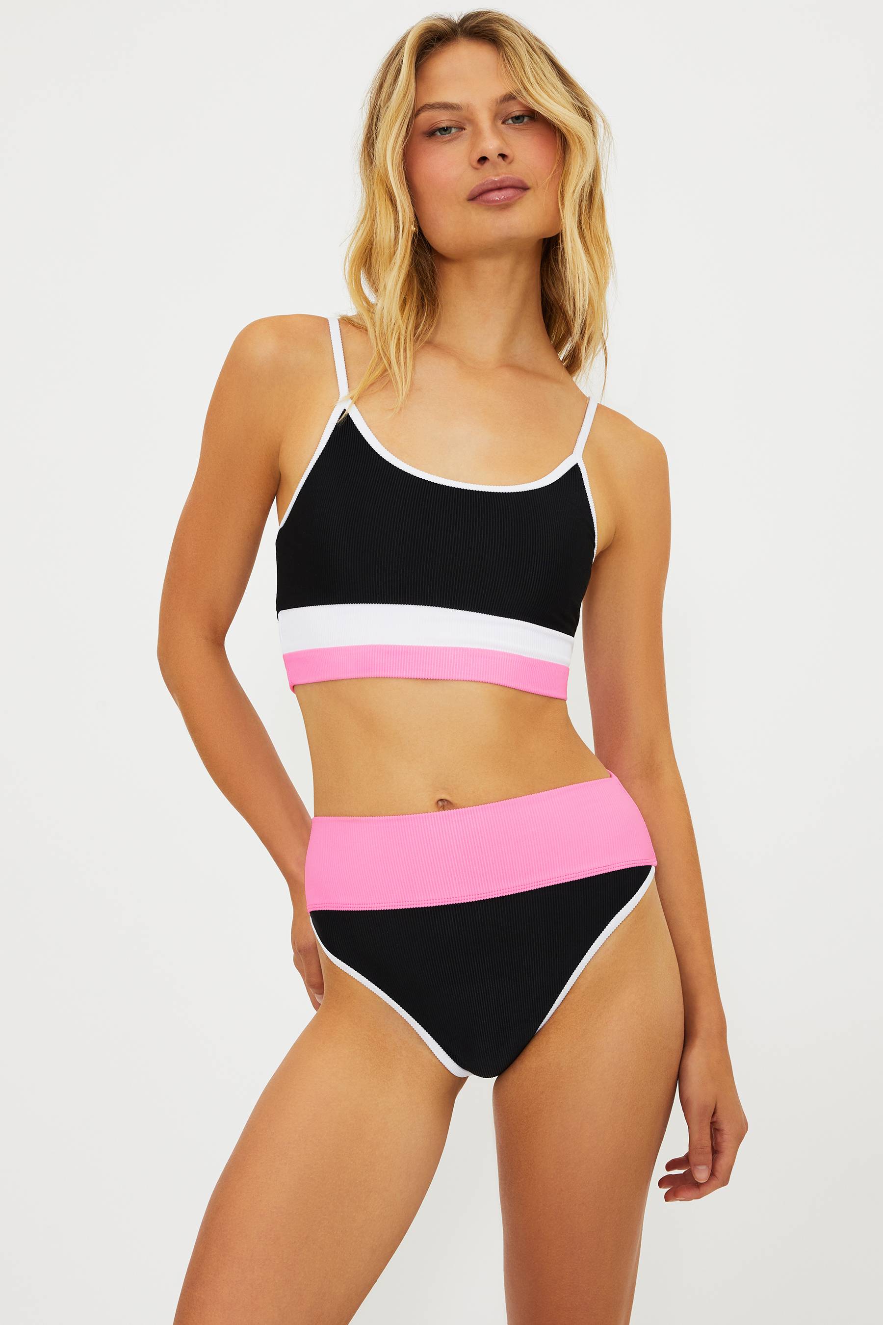 pink, black and white colorblocked ribbed swim set with a bralette style top and high waisted swim bottoms